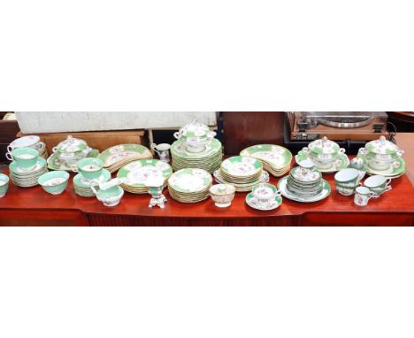 MINTONS GREEN COCKATRICE PATTERNa part dinner service, mostly early 20th century, with a part Dresden service in a similar pa