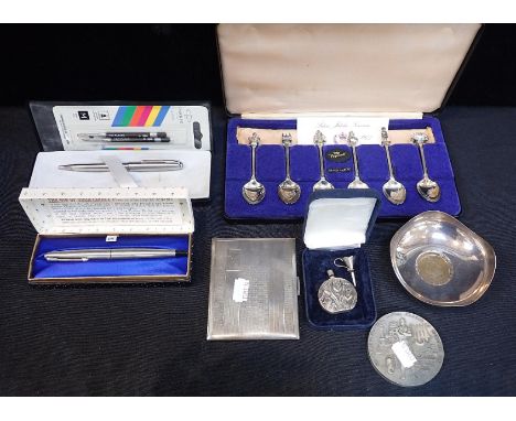 A GEORGE V SILVER CIGARETTE CASEBirmingham 1937, a silver ashtray inset with George III Cartwheel penny, a silver scent bottl