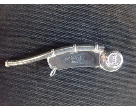 A SILVER ROYAL NAVAL BOSUN'S WHISTLEengraved 'Peter, 1915', Chester, possibly Haseler Bros. (mark partially obscured by teeth