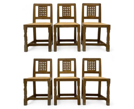 Mouseman - set of six oak dining chairs, pierced and carved lattice panel back over tan leather seat with studded band, on oc