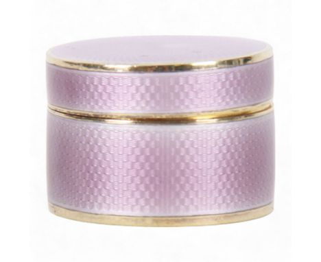 Small early 20th century silver gilt and lilac guilloche enamel box, of cylindrical form, the cover lifting to reveal a gilt 