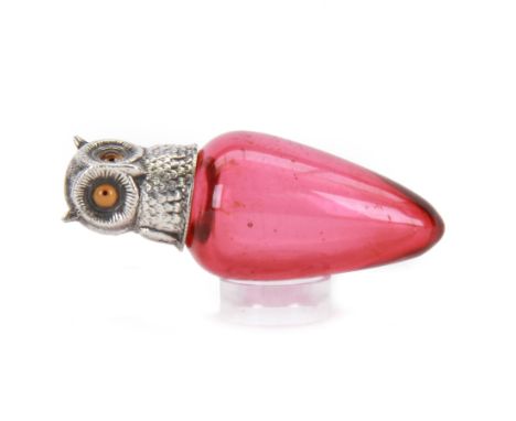 Small Victorian silver topped cranberry glass scent bottle, the ovoid glass body with screw threaded silver cover modelled in