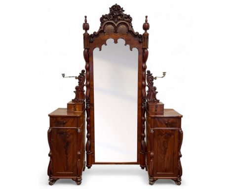 Tall Victorian figured mahogany twin pedestal dressing table, the tall mirror with flower head and scrolled leaf carved pedim