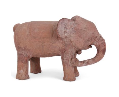 16th century style Javanese terracotta model of an Indian Elephant, with carved saddle, chain around neck and adornment to tr