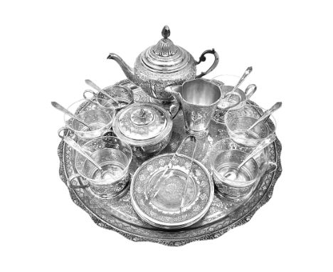 Early/mid 20th century Persian silver tea service, comprising circular serving tray, teapot, twin handled sucrier and cover, 