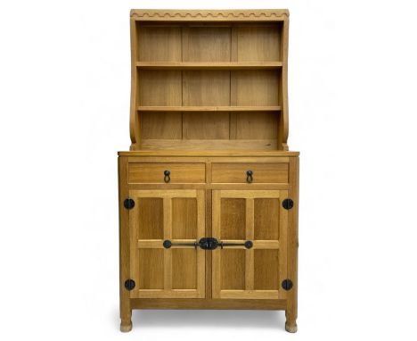 Mouseman - oak dresser, penny moulded cresting rail over two shelves supported by shaped ends, canted rectangular adzed top, 