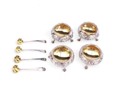Cased set of four Victorian silver open salts, each of cauldron form with embossed foliate decoration, gadrooned rim and gilt