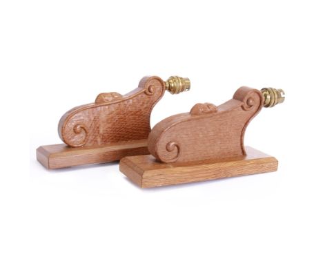 'Mouseman' pair of carved oak wall lights or sconces, scrolled decoration on chamfered rectangular mount, carved with mouse s