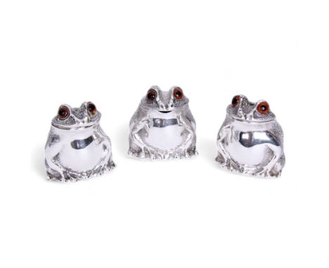 Modern silver three piece novelty cruet set, comprising salt, pepper and mustard, modelled as seated toads with textured back