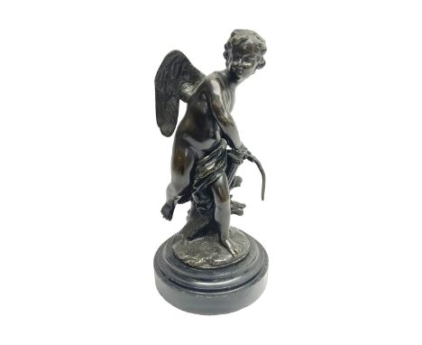 Bronze figure in the manner of Louis-Simon Boizot, modelled as Cupid withdrawing an arrow from his quiver, indistinctly signe