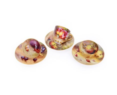 Three small 20th century Royal Worcester cabinet cups and saucers, each painted with a still life of fruit upon a mossy groun