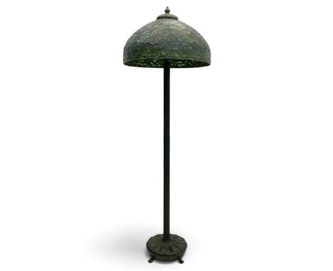 In the manner of Tiffany & Co. - bronze 'Chased Pod' design floor lamp, 'Maple Leaf' dome leaded glass shade decorated with f