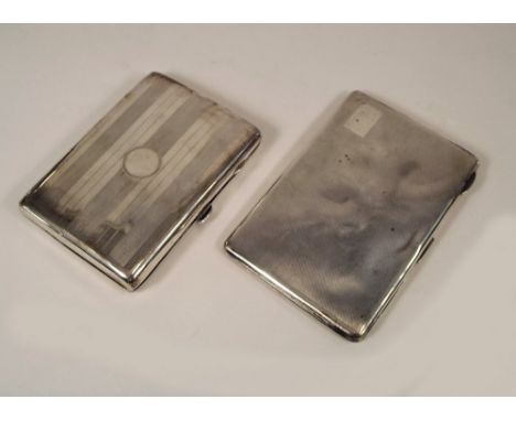 CIGARETTE CASES. Two engine turned silver cigarette cases. Approx. 12½oz.