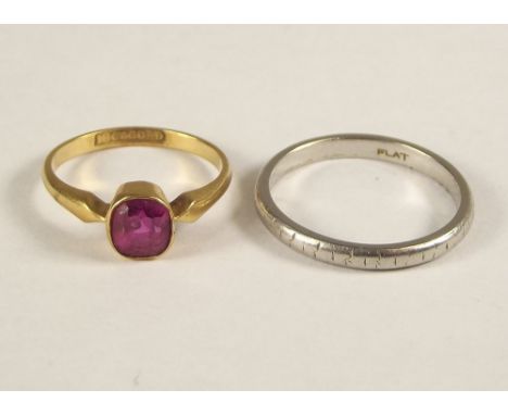 WEDDING BAND ETC. A platinum wedding band, approx. 3.5g. &amp; an 18ct. gold ruby set ring.