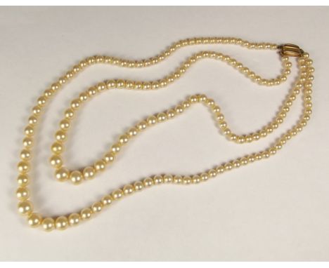 CIRO PEARLS. A Ciro faux pearl, double strand necklace with 9ct. gold clasp. Original box.