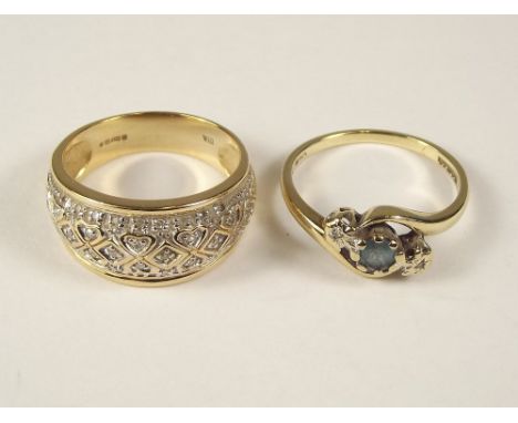 GOLD RINGS. A 9ct. gold diamond crossover ring &amp; a modern 9ct. gold diamond dress ring.