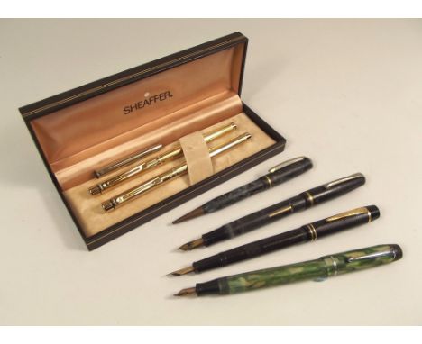 FOUNTAIN PENS ETC.
A Sheaffer gold tone, white spot pen & biro set, an Onoto fountain pen with transparent barrel, two other 