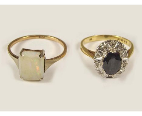 DRESS RINGS. A 9ct. gold opal dress ring &amp; an 18ct. gold sapphire dress ring.