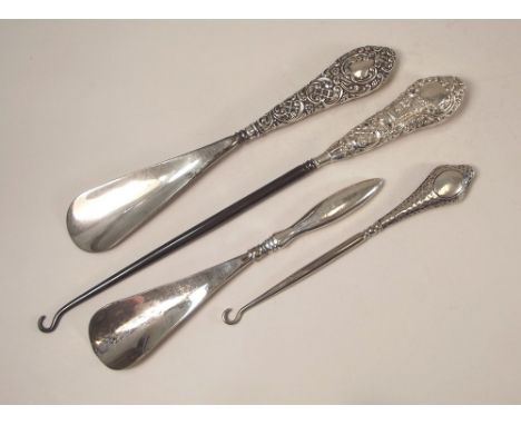 SHOE LIFTS ETC. Two silver mounted shoe lifts &amp; two button hooks.