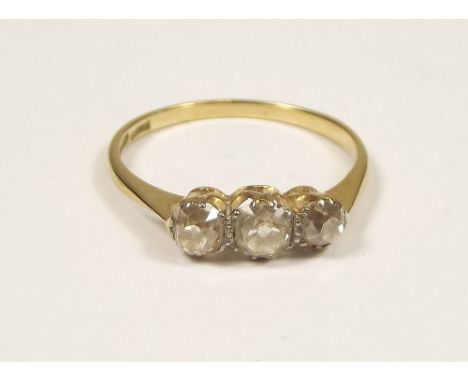 DIAMOND RING. An 18ct. gold ring set with three old cut diamonds. Approx. 1.1total ct.