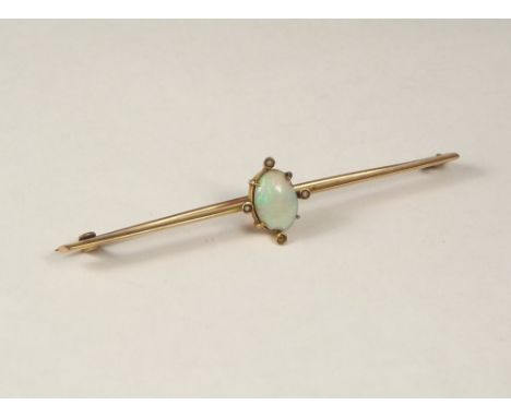 OPAL BROOCH. A large opal &amp; seed pearl bar brooch. (one pearl missing, opal chipped)