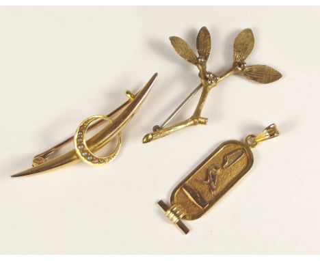 BROOCHES ETC. A 9ct. gold mistletoe brooch (repaired), an Edwardian seed pearl brooch &amp; an Egyptian yellow metal pendant.