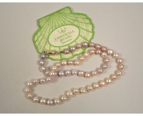 PEARLS. A pink potato pearl necklace, with 9ct. gold clasp.