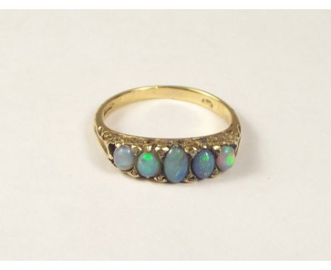 OPAL RING. An 18ct. gold opal ring. Size K/L.