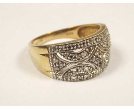 DIAMOND RING. A 9ct. gold ring, pave set with diamonds. Size S/T.