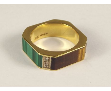 GOLD RING. An unusual 18ct. gold ring set with tiger's eye, lapis, black onyx, malachite &amp; pairs of diamonds at each corn