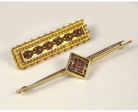 BAR BROOCHES. A 9ct. gold ruby set bar brooch &amp; a Victorian yellow metal bar brooch.