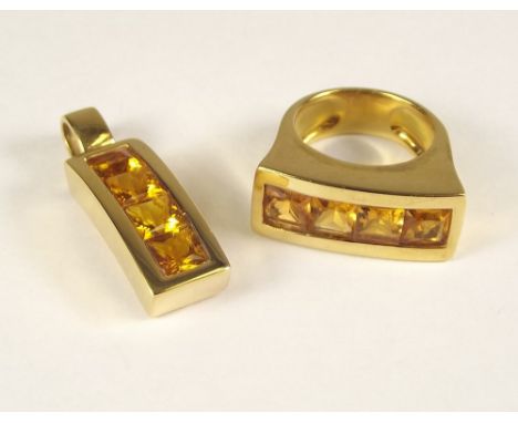 CITRINE SUITE. A large 18ct. gold ring, set a row of 4 square cut citrines. Size R. Approx. 16.5g. Total width 2.6cm. Sold wi