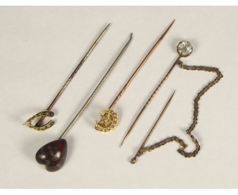 STICK PINS. Four stick pins including Cornish serpentine &amp; 18ct. gold &amp; half pearl.