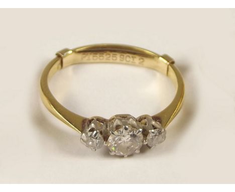 DIAMOND RING. An 18ct. gold &amp; platinum, three stone diamond ring.