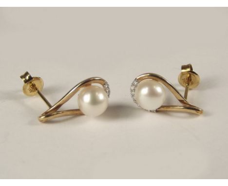 PEARL EARRINGS. A pair of 9ct. gold &amp; cultured pearl earrings, set a row of eight diamonds. Pearl approx 6mm.