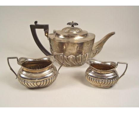 TEA SERVICE. A presentation teapot, London 1900 &amp; a matched cream jug &amp; sugar bowl, Birmingham 1903. Approx. 28oz.