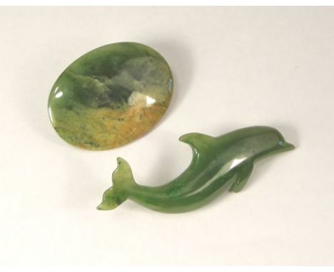 JADE BROOCHES. A New Zealand Bush Fire jade brooch &amp; a Canadian jade dolphin brooch. Both with boxes &amp; leaflets.