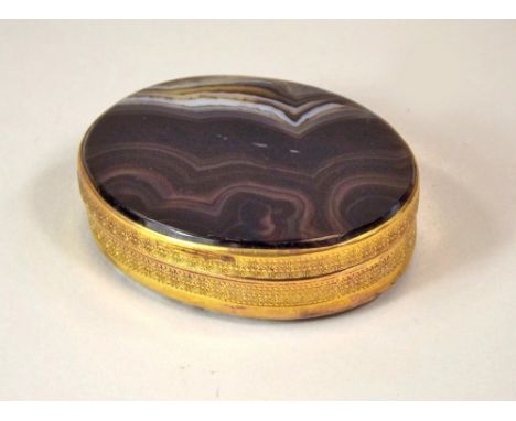 AGATE SNUFF BOX. A 19th century banded agate snuff box with gilt metal mounts. 5.5 x 4.5cm.