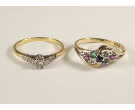 GOLD RINGS. A 9ct. gold dress ring set a variety of gem stones &amp; an illusion set diamond ring.