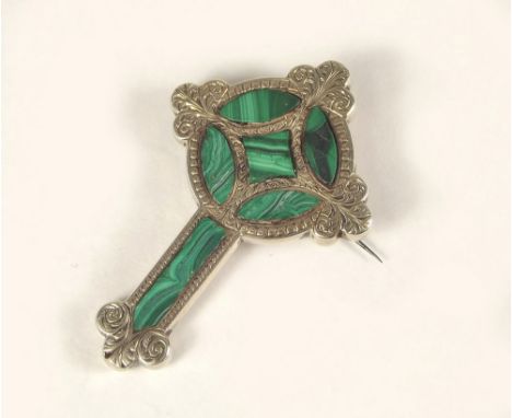 MALACHITE BROOCH. A silver Celtic cross brooch set with malachite.