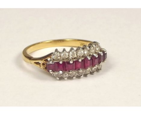 RUBY RING. An 18ct. gold diamond &amp; ruby three row ring. Size N/O.