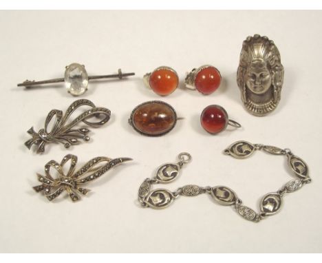 MARCASITE ETC.
Two silver & marcasite brooches, a silver mask ring, a Celtic silver bracelet & other silver jewellery.