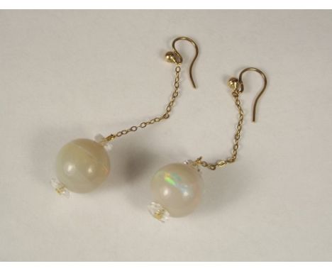 OPAL EARRINGS. A pair of 9ct. gold mounted opal earrings. Each opal approx. 10ct. Length 6cm.