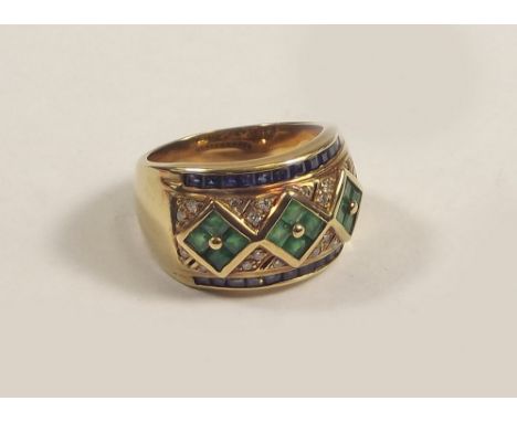 GOLD RING.
A 9ct. gold large dress ring, set with square cut emeralds, sapphires & small brilliant cut diamonds. Size P. Appr