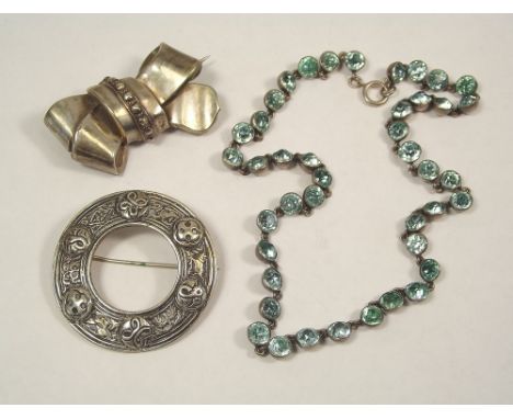 CELTIC PIN ETC.
A Celtic inspired silver brooch, Chester 1952, one other brooch & a paste set necklace.