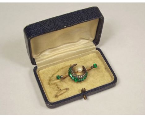 GARNET BROOCH. A yellow metal, garnet doublet, pearl &amp; diamond set brooch. Original box. Length 4.5cm.