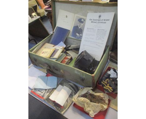 A selection of military related items to include letters, buttons, books, a signalling lamp and other items 