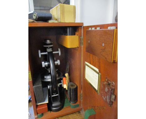 A boxed J Swift &amp; Son microscope and accessories, together with a cased Zeiss Ikon camera 