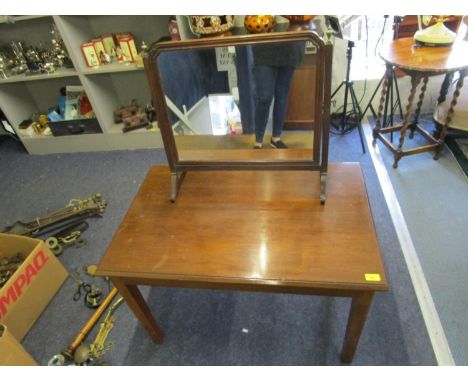 A Georgian mahogany swing mirror with brass urn finials and a later mahogany coffee table 