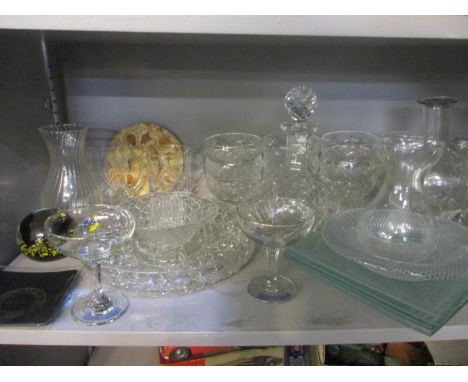 A mixed lot of glassware to include cut glass and cut glass decanters, a Babycham glass and a Caithness Tropicana paperweight